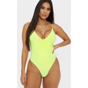 Prettylittlething Neon yellow bodysuit in size 4